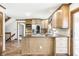 Bright kitchen featuring stainless steel appliances, granite countertops, tile backsplash, and custom wood cabinetry at 7411 Perrier Dr, Indianapolis, IN 46278