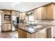 Well-lit kitchen featuring granite countertops, stainless steel appliances, and a gas cooktop at 7411 Perrier Dr, Indianapolis, IN 46278