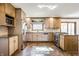 Charming kitchen featuring stainless steel appliances, unique backsplash, and ample counter space at 7411 Perrier Dr, Indianapolis, IN 46278