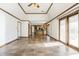 Open-concept living room with tile floors and sliding door access to the exterior at 7411 Perrier Dr, Indianapolis, IN 46278