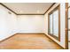 Bright office space featuring a window and hardwood floors, perfect for a work-from-home environment at 7411 Perrier Dr, Indianapolis, IN 46278