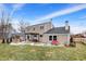 Spacious backyard with a patio area, seating, and fenced perimeter at 803 Hickory Way, Noblesville, IN 46062