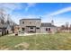 Large backyard with a pergola over a patio area and partial snow cover at 803 Hickory Way, Noblesville, IN 46062