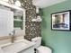 Stylish half bathroom with decorative wallpaper and modern sink at 803 Hickory Way, Noblesville, IN 46062
