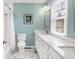 Bright bathroom featuring granite countertops, white cabinetry, and marble floors at 803 Hickory Way, Noblesville, IN 46062