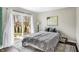 Calm bedroom with a sliding glass door with backyard view at 803 Hickory Way, Noblesville, IN 46062