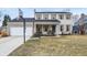 Charming two-story home features a brick facade, attached garage, and front porch with swing at 803 Hickory Way, Noblesville, IN 46062