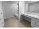 Clean bathroom with a white tub, vanity, mirror, and tiled floor at 8310 Bearberry Ln, Pendleton, IN 46064