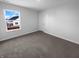 Cozy bedroom with gray carpet, a large window, and neutral walls at 8310 Bearberry Ln, Pendleton, IN 46064