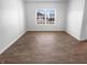 Inviting living room area with light wood floors and a bright window view at 8310 Bearberry Ln, Pendleton, IN 46064