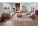 Comfortable living room with a large window, modern furniture, rug, and hardwood floors at 8310 Bearberry Ln, Pendleton, IN 46064