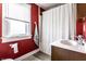 This bathroom features a shower, sink, and a window at 85 N Dearborn St, Indianapolis, IN 46201