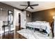 This is a bedroom with hardwood floors, ceiling fan, and gray paint at 85 N Dearborn St, Indianapolis, IN 46201