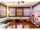 Bright bedroom featuring natural light, hardwood floors, and ample space for play and relaxation at 85 N Dearborn St, Indianapolis, IN 46201