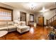 Cozy living room featuring hardwood floors, a comfortable sectional sofa, and ample natural light at 85 N Dearborn St, Indianapolis, IN 46201