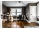 This office has hardwood floors, dark paint and a ceiling fan at 85 N Dearborn St, Indianapolis, IN 46201