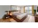 Modern bedroom featuring a large bed, two bedside tables and big windows at 8751 Jaffa Court E Dr # 17, Indianapolis, IN 46260