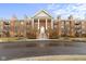 Beautiful brick condo building with columns, a front lawn and dark-paved entrance at 8751 Jaffa Court E Dr # 17, Indianapolis, IN 46260