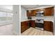 Kitchen featuring wooden cabinets, stainless steel appliances, and great lighting at 8751 Jaffa Court E Dr # 17, Indianapolis, IN 46260