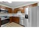 Updated kitchen featuring stainless steel appliances, wood cabinets, and great lighting at 8751 Jaffa Court E Dr # 17, Indianapolis, IN 46260