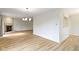 Spacious living room with fireplace, neutral walls, and wood floors at 8751 Jaffa Court E Dr # 17, Indianapolis, IN 46260