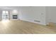 Spacious living room with new floors and natural light and fireplace at 8751 Jaffa Court E Dr # 17, Indianapolis, IN 46260