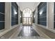 Bright lobby with a window at the end of the hallway and sconce lighting at 8751 Jaffa Court E Dr # 17, Indianapolis, IN 46260