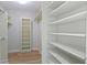 Bright walk-in closet with built-in shelving and ample storage space at 8751 Jaffa Court E Dr # 17, Indianapolis, IN 46260