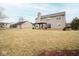 Large grassy backyard featuring a covered patio, perfect for outdoor entertaining at 9078 N River Chase Ln, McCordsville, IN 46055
