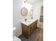 This bathroom features a double sink vanity with wood cabinets and vinyl floors at 9078 N River Chase Ln, McCordsville, IN 46055