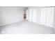 A spacious carpeted bedroom featuring double closets at 9078 N River Chase Ln, McCordsville, IN 46055