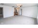 Spacious bonus room with staircase, neutral carpet and multiple doorways at 9078 N River Chase Ln, McCordsville, IN 46055