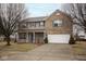 Charming two-story home with a two-car garage, brick accents, and blue shutters at 9078 N River Chase Ln, McCordsville, IN 46055