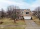 Charming two-story home with a two-car garage, brick accents, and blue shutters at 9078 N River Chase Ln, McCordsville, IN 46055