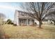 Classic two-story house with a well-maintained lawn, blue shutters, and a welcoming front entrance at 9078 N River Chase Ln, McCordsville, IN 46055