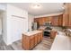 Bright kitchen featuring a center island, stainless steel appliances, modern cabinets, and wood-look flooring at 9078 N River Chase Ln, McCordsville, IN 46055
