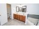 The main bathroom features a double sink vanity, soaking tub, and convenient toilet room at 9078 N River Chase Ln, McCordsville, IN 46055