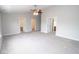 Spacious main bedroom featuring plush carpeting, a modern ceiling fan, and neutral paint at 9078 N River Chase Ln, McCordsville, IN 46055