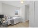 Simple bedroom with white metal bed frame and hardwood floors at 10539 Mcpherson St, Carmel, IN 46280