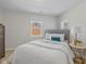Comfortable bedroom with a padded headboard, and hardwood flooring at 10539 Mcpherson St, Carmel, IN 46280