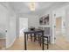 Dining room features a dark wood table and modern lighting, perfect for Gathering meals at 10539 Mcpherson St, Carmel, IN 46280