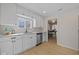 Modern kitchen features white cabinets, stainless steel appliances, and durable countertops at 10539 Mcpherson St, Carmel, IN 46280