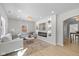 Bright living room featuring recessed lighting, a modern fireplace, and an open archway at 10539 Mcpherson St, Carmel, IN 46280