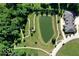 Aerial view of a pond and walking path with gazebo near a house in a lush neighborhood at 1148 Easy St # B, Greenwood, IN 46142