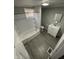 Clean bathroom with tub shower combo, vanity, and neutral color scheme at 1207 N Kealing Ave, Indianapolis, IN 46201