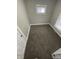 Cozy bedroom with neutral carpet and ample natural light at 1207 N Kealing Ave, Indianapolis, IN 46201