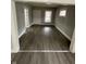 Bright living room with gray floors, offering a modern and inviting space at 1207 N Kealing Ave, Indianapolis, IN 46201