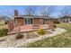 Spacious backyard with a wooden deck and stone details at 126 S Mustin Dr, Anderson, IN 46012