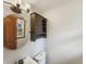 Cozy half-bathroom with round mirror and wall cabinet for storage at 126 S Mustin Dr, Anderson, IN 46012
