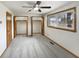 Bedroom featuring wall-to-wall closets and a ceiling fan at 126 S Mustin Dr, Anderson, IN 46012
